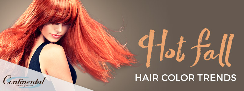 A young woman with long red hair, hot fall hair trends
