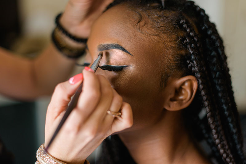 woman getting makeup done